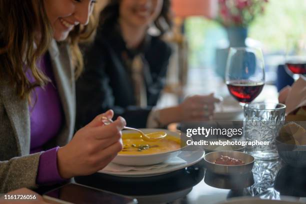 eating soup during business lunch - eating soup stock pictures, royalty-free photos & images