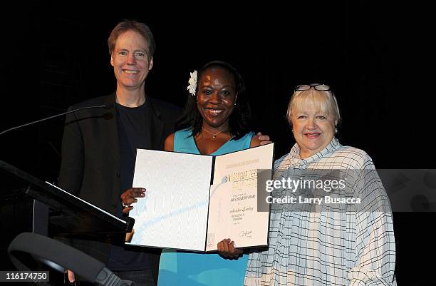 Award Recipient Markeisha Esley with presenters Hugh Wilson and Ann Ruckert pose onstage at the Songwriters Hall of Fame/NYU Master Session +...