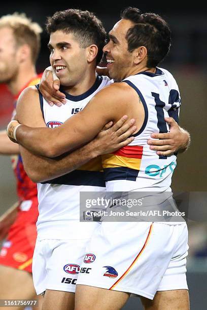 Tyson Stengle of the Crows celebrates his goal with team mate Eddie Betts during the round 17 AFL match between the Gold Coast Suns and the Adelaide...