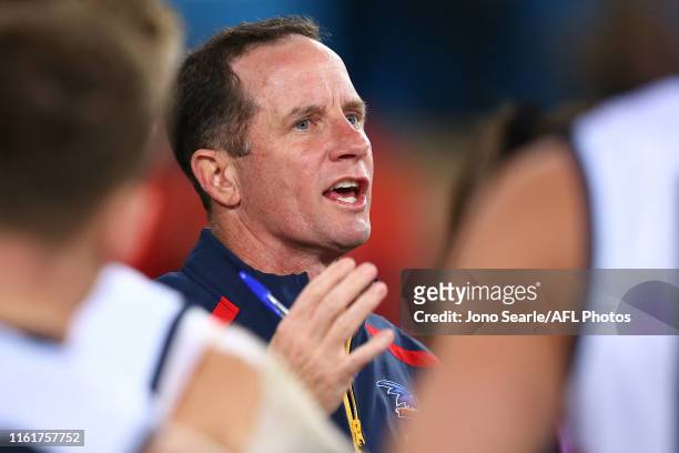 Crows coach Don Pyke talks to his team during the round 17 AFL match between the Gold Coast Suns and the Adelaide Crows at Metricon Stadium on July...