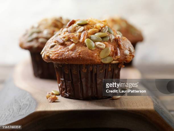 trail mix carrot muffin with nuts and seeds - muffin stock pictures, royalty-free photos & images