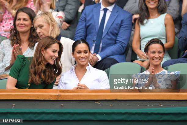 Catherine, Duchess of Cambridge, Meghan, Duchess of Sussex and Pippa Middleton in the Royal Box on Centre Court during day twelve of the Wimbledon...
