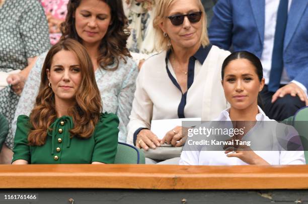 Catherine, Duchess of Cambridge and Meghan, Duchess of Sussex in the Royal Box on Centre Court during day twelve of the Wimbledon Tennis...