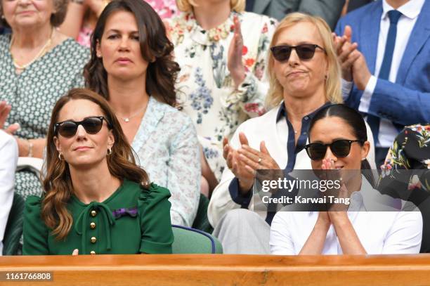 Catherine, Duchess of Cambridge and Meghan, Duchess of Sussex in the Royal Box on Centre Court during day twelve of the Wimbledon Tennis...