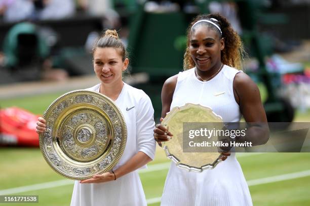 Simona Halep of Romania, winner and Serena Williams of The United States, runner-up pose for a photo with their respective trophies after the Ladies'...