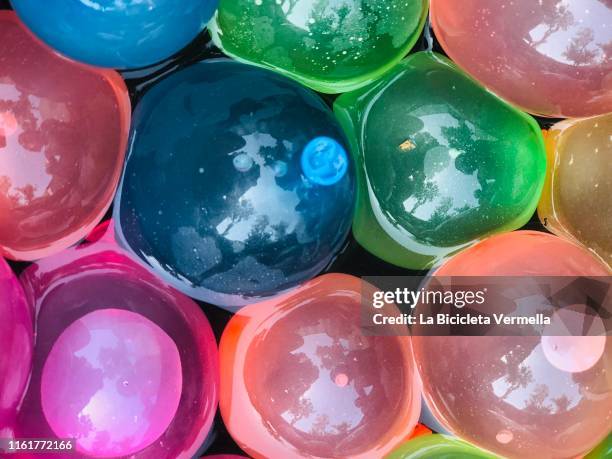 water baloons - color explosion water stock pictures, royalty-free photos & images