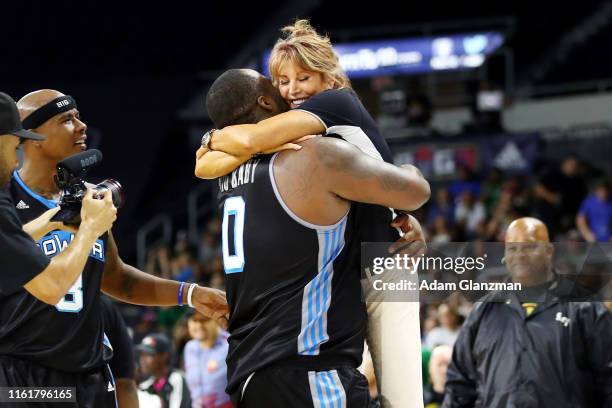 Glen 'Big Baby' Davis of the Power celebrates with head coach Nancy Lieberman after defeating the Ghost Ballers 50-36 during week four of the BIG3...