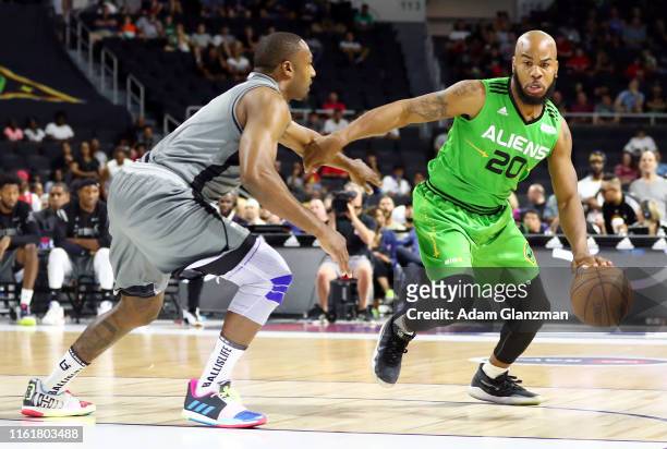 Andre Owens of the Aliens dribbles against Gilbert Arenas of the Enemies during week four of the BIG3 three on three basketball league at Dunkin'...
