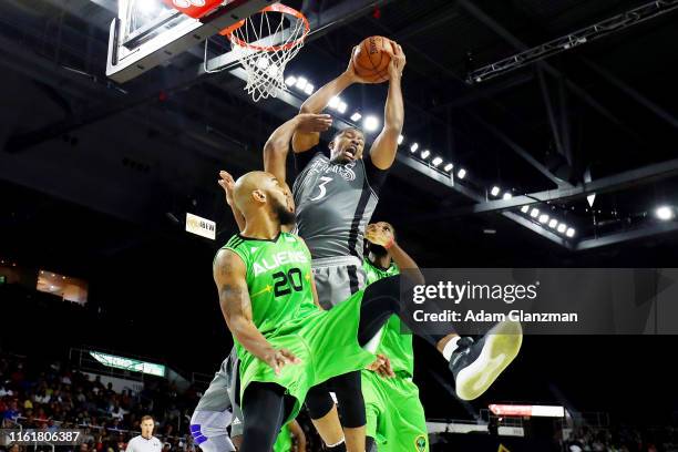 Craig Smith of the Enemies battles for the ball against Andre Owens of the Aliens during week four of the BIG3 three on three basketball league at...