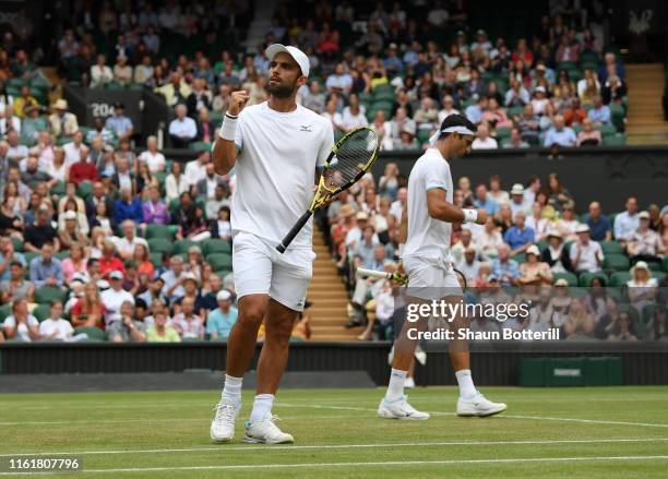 Robert Farah of Colombia, playing partner of Juan Sebastian Cabal of Colombia celebrates in their Men's Doubles final against Nicolas Mahut of France...