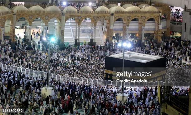 Muslim pilgrims circumambulate the Kaaba, Islam's holiest site, located in the center of the Masjid al-Haram, Saudi Arabia on August 14 after stoning...