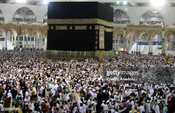 Muslim pilgrims circumambulate the Kaaba, Islam's holiest site, located in the center of the Masjid al-Haram, Saudi Arabia on August 14 after stoning...