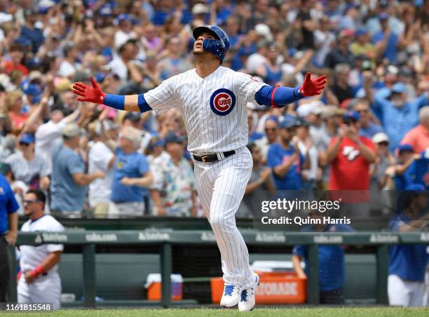 Willson Contreras of the Chicago Cubs reacts after hitting a three run home run in the first inning against the Pittsburgh Pirates at Wrigley Field...