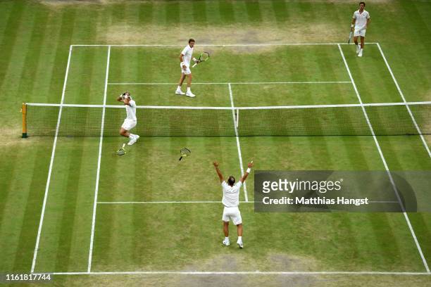 Sebastian Cabal of Colombia and playing partner Juan Robert Farah of Colombia celebrate match point in their Men's Doubles final against Nicolas...