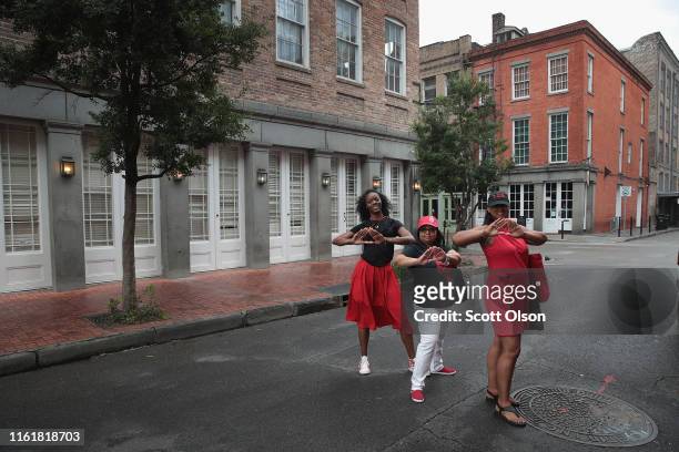 Latiya White , Gina Murray and Gina Holmes, all member of the the Delta Sigma Theta Sorority from Atlantic City, New Jersey, pose for a picture in...