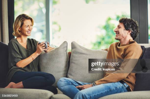 coffee dates on the couch - man having tea stock pictures, royalty-free photos & images