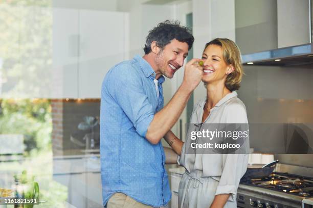 nur ein knabbern... - middle aged couple cooking stock-fotos und bilder