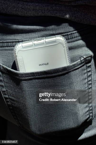 Teenage girl carries her iPhone in the back pocket of her jeans in Santa Fe, New Mexico.