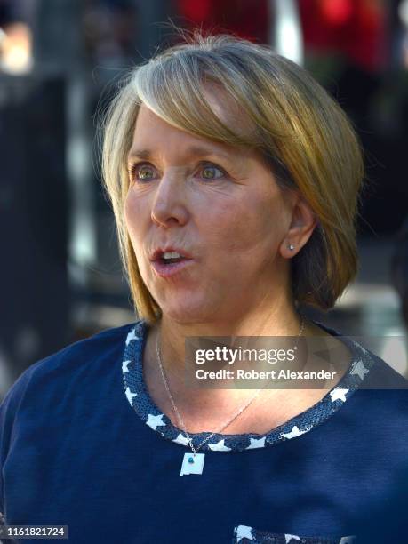 Michelle Lujan Grisham, the governor of New Mexico, talks with supporters at a Fourth of July event in Santa Fe, New Mexico. Lujan Grisham, a...