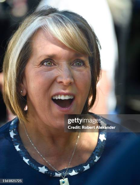 Michelle Lujan Grisham, the governor of New Mexico, talks with supporters at a Fourth of July event in Santa Fe, New Mexico. Lujan Grisham, a...