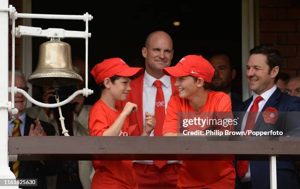 Andrew Strauss and his sons Luca and Sam wait to ring the five minute bell on Ruth Strauss day, the second day of the second Specsavers test match...