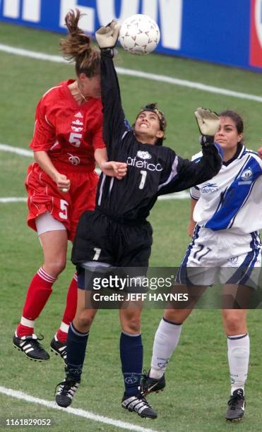 Andrea Neil of Canada fights Guatemala's goalie Susana De Leon for the ball as Linda Castillejos of Guatemala looks on 28 June 2000, in the first...