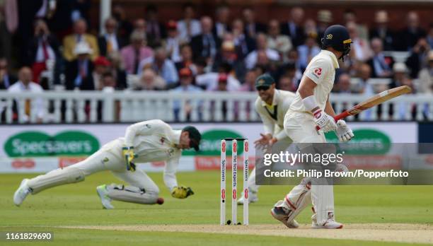 Rory Burns of England watches as he is dropped by Tim Paine of Australia during the second day of the second Specsavers test match between England...