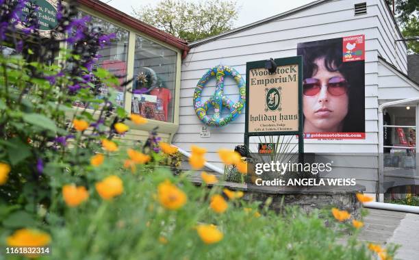 View of posters and signs on Tinker Street on August 14, 2019 in Woodstock, New York. - The town of Woodstock -- a municipality 107 miles north of...