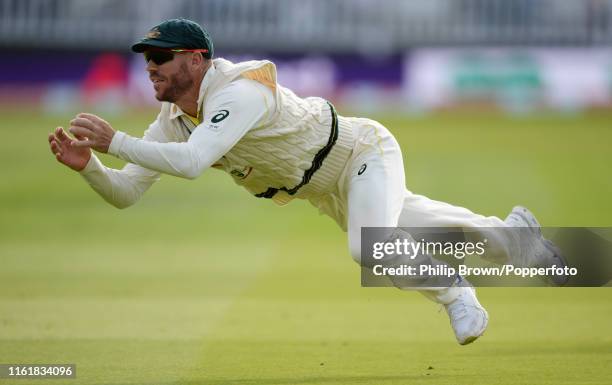 David Warner of Australia drops a chance from the bat of Stuart Broad of England during the second day of the second Specsavers test match between...