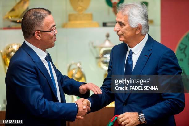 Fouzi Lekjaa , President of Morocco's Royal Football Federation , presents Bosnian coach Vahid Halilhodzic as the new coach of the Moroccan national...