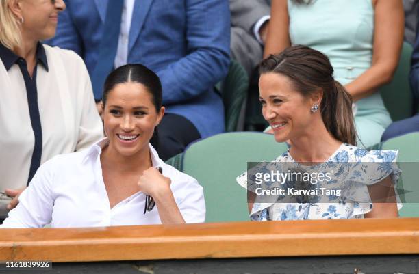 Meghan, Duchess of Sussex and Pippa Middleton in the Royal Box on Centre Court during day twelve of the Wimbledon Tennis Championships at All England...