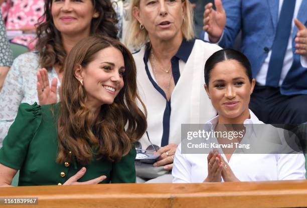 Catherine, Duchess of Cambridge and Meghan, Duchess of Sussex in the Royal Box on Centre Court during day twelve of the Wimbledon Tennis...