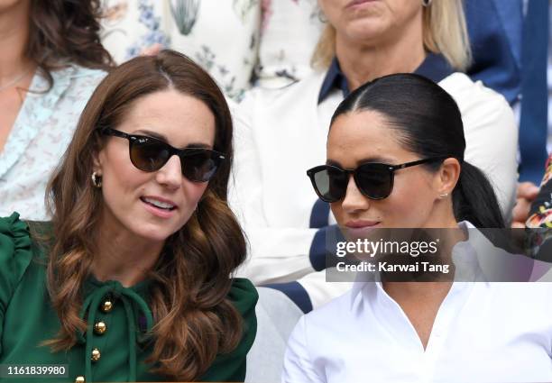 Catherine, Duchess of Cambridge and Meghan, Duchess of Sussex in the Royal Box on Centre Court during day twelve of the Wimbledon Tennis...