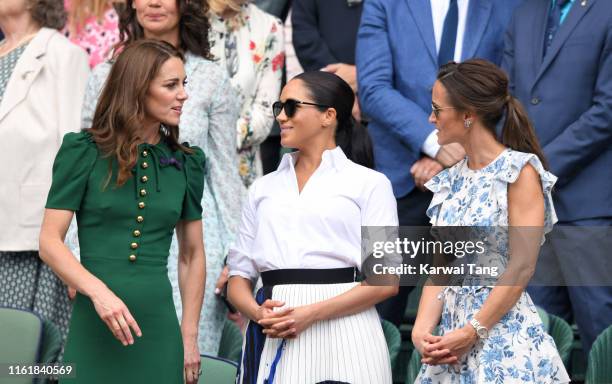 Catherine, Duchess of Cambridge, Meghan, Duchess of Sussex and Pippa Middleton in the Royal Box on Centre Court during day twelve of the Wimbledon...