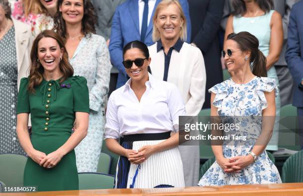 Catherine, Duchess of Cambridge, Meghan, Duchess of Sussex and Pippa Middleton in the Royal Box on Centre Court during day twelve of the Wimbledon...