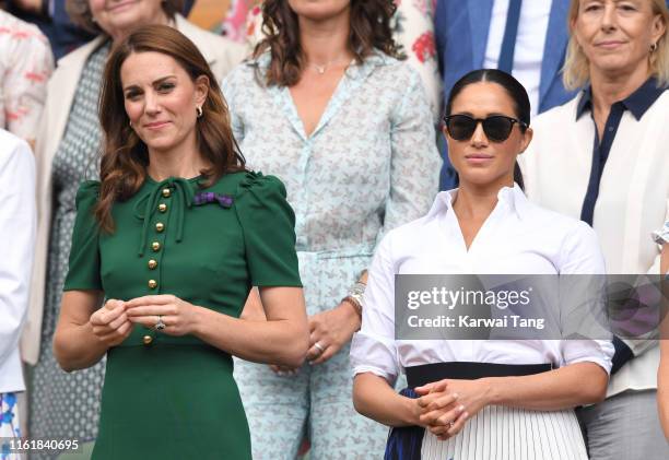 Catherine, Duchess of Cambridge and Meghan, Duchess of Sussex in the Royal Box on Centre Court during day twelve of the Wimbledon Tennis...