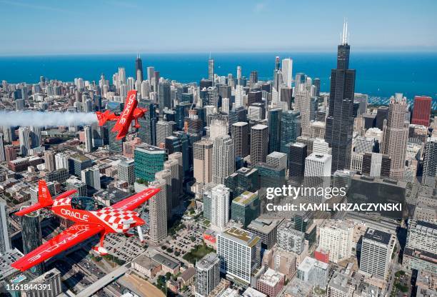 Team Oracle, Hall of Fame Air Show Performer Sean D. Tucker and Jessy Panzer fly their aircrafts over Chicago as they prepare for the 61th annual...