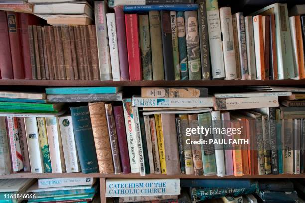 Library of books are seen in the bedroom in the three roomed thatched cottage home of Margaret Gallagher near the village of Belcoo, Enniskillen,...
