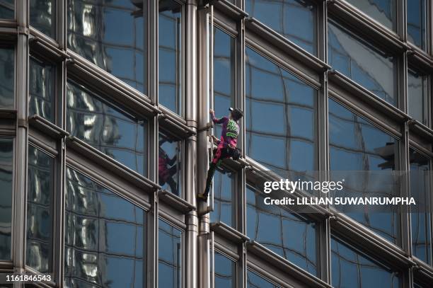 French urban climber Alain Robert, popularly known as the "French Spiderman", climbs the Cheung Kong Center building in Hong Kong on August 16, 2019....