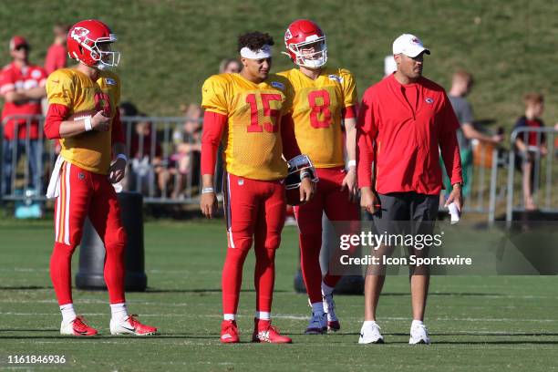 Kansas City Chiefs quarterbacks Patrick Mahomes and Chase Litton stand with coach Mike Kafka during Chiefs training camp on August 14, 2019 at...