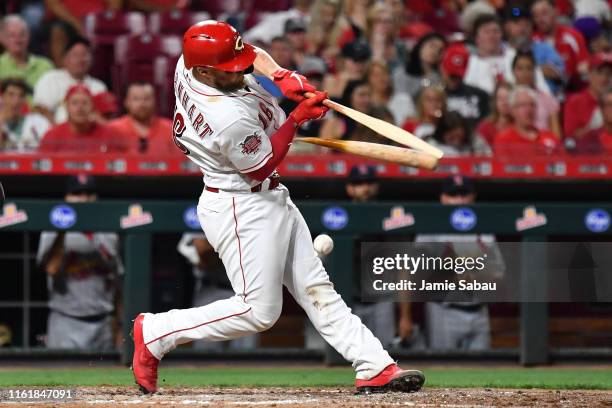 Tucker Barnhart of the Cincinnati Reds breaks his bat on a hit ball in the sixth inning against the St. Louis Cardinals at Great American Ball Park...