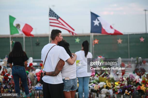 People gather at a makeshift memorial honoring victims outside Walmart August 15, 2019 in El Paso, Texas. 22 people were killed in the Walmart during...