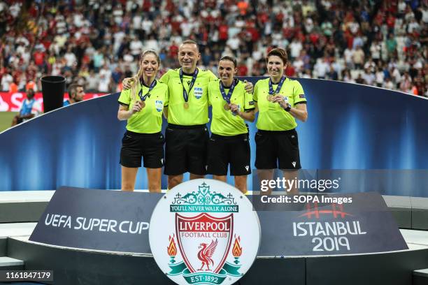 Referee Stephanie Frappart poses with her Assistants Manuela Nicolosi and Michelle O'Neill with their medals at the end of the UEFA Super Cup match...