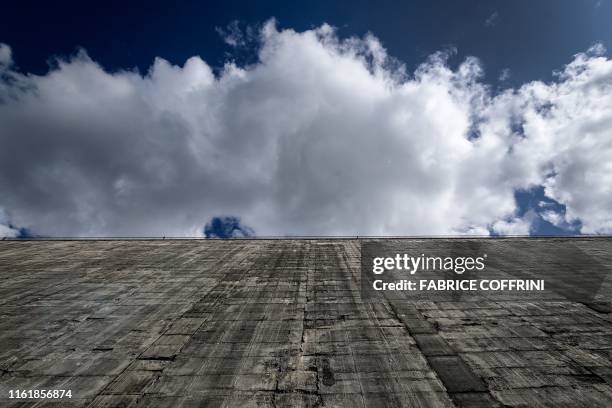 This picture taken on Augut 15, 2019 shows a view of the Cleuson dam above Haute-Nendaz, southern Switzerland. - The water from the Clauson lake is...