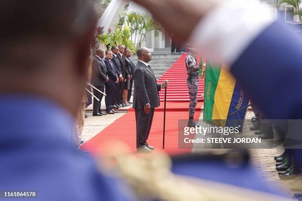 Gabon President Ali Bongo reviews troops at a ceremony in Libreville on August 16, 2019 at the Mausoleum of the Country First President during a...