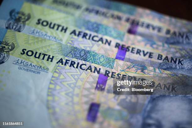 South African rand banknotes sit in this arranged photograph in Pretoria, South Africa, on Wednesday, Aug. 14, 2019. The rand ended a tumultuous week...