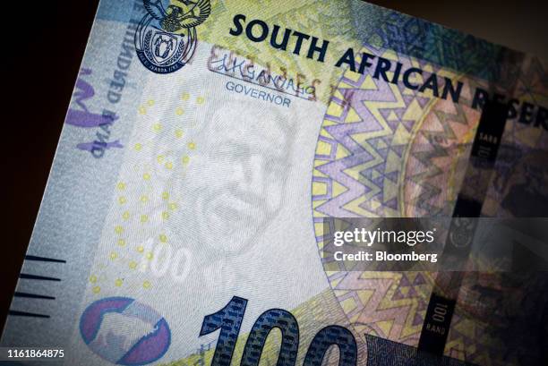 The security image of former South African President Nelson Mandela sits on a 100 South African rand banknote in this arranged photograph in...