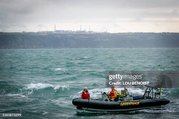 Greenpeace activist sail on an inflatable boat off the EPR of Flamanville The Hague, in the sea of Manche, on August 16, 2019. The Rainbow Warrior...