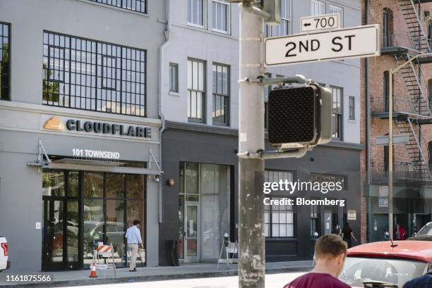 Pedestrians walk past the Cloudflare Inc. Headquarters in San Francisco, California, U.S., on Thursday, Aug. 15, 2019. Cloudflare, a firm that helps...