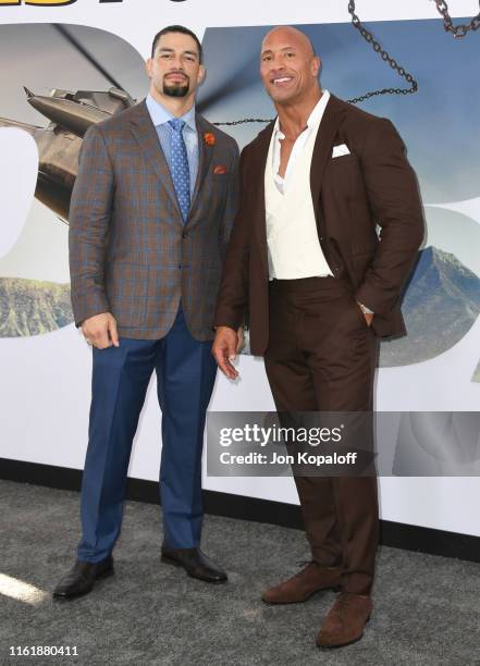 Roman Reigns and Dwayne Johnson attend the Premiere Of Universal Pictures' "Fast & Furious Presents: Hobbs & Shaw" at Dolby Theatre on July 13, 2019...